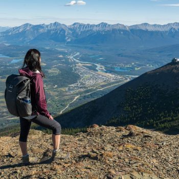 A Woman Standing on Mountain Peak