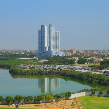 city buildings near body of water during daytime